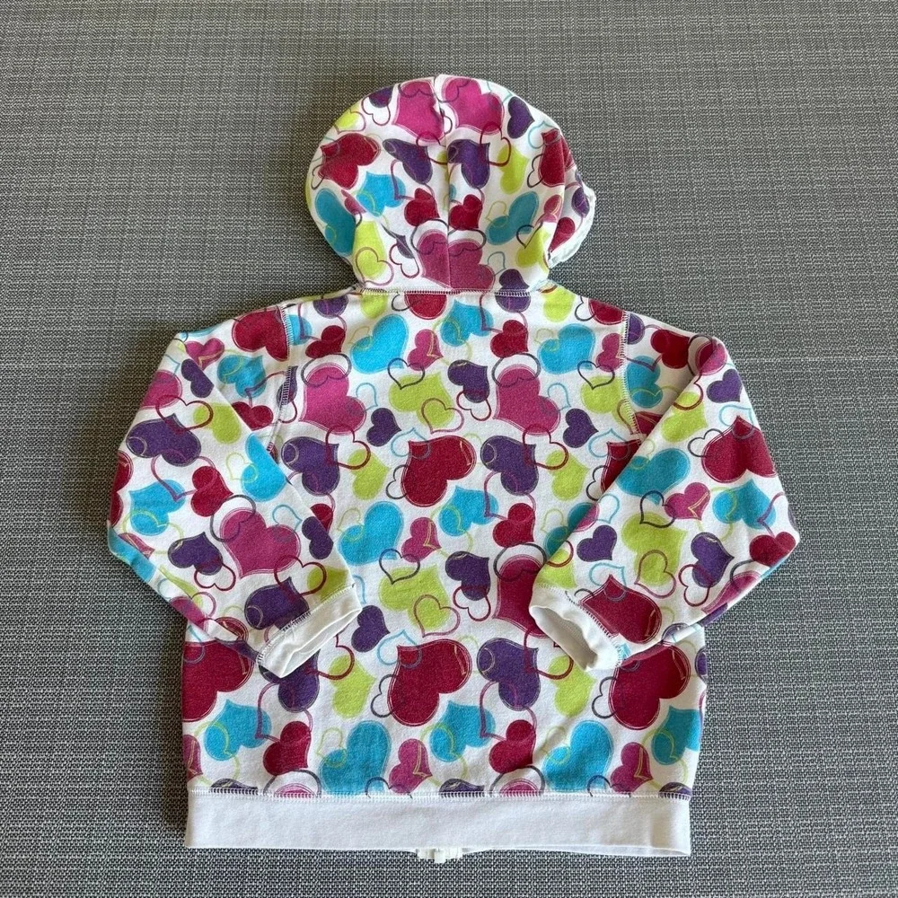 Okie-dokie Multi-colored heart print zip-up hoodie.
